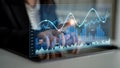 Business Professional Using Digital Tablet to Analyze Financial Data with Interactive Graph Display, Modern Office Royalty Free Stock Photo