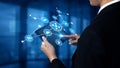 Business professional using digital tablet to interact with network of technology icons in modern office environment Royalty Free Stock Photo