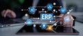 Business professional using digital technology with ERP system interface connecting various functions like payroll Royalty Free Stock Photo