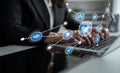 Business Professional Using Laptop with Digital Connection Icons Representing Data Analysis, Networking, and Technology Royalty Free Stock Photo
