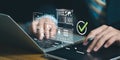 Business professional using laptop, tablet with digital approval checkmark, AI analytics dashboard, verified documents, secure Royalty Free Stock Photo