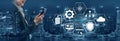Business Professional Using Smartphone with Digital Icons Representing Technology, Cloud Computing, Data Analytics and Royalty Free Stock Photo
