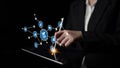 Business Professional Using Tablet for Digital Networking with Futuristic Icons Representing Communication, Technology Royalty Free Stock Photo