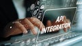 Business professional working on keyboard with API integration graphics and digital interface elements displaying data Royalty Free Stock Photo