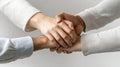 Business professionals clasp hands to signify unity and teamwork, showcasing their mutual commitment to corporate Royalty Free Stock Photo