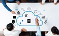 Business professionals collaborating on cloud computing strategy with icons illustrating data management, storage Royalty Free Stock Photo