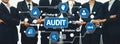 Business professionals conducting an audit with digital interface and icons representing compliance, findings, material Royalty Free Stock Photo