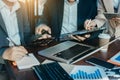 Business professionals. Group of young confident business people analyzing data using computer while spending time in the office Royalty Free Stock Photo