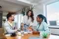 Business professionals. Group of young confident business people analyzing data using computer while spending time in the office. Royalty Free Stock Photo