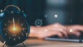 Business professionals manage time effectively using digital workflow systems. Alarm clock with virtual icons and working hands Royalty Free Stock Photo