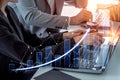 Business professionals analyzing financial data with laptop and graphs showing growth trends and investment Royalty Free Stock Photo
