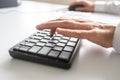 Business programmer using computer keyboard and mouse