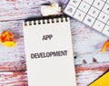 Business, programming, interface, application and network concept. Text APP DEVELOPMENT in a notebook against the Royalty Free Stock Photo
