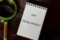 Business, programming, interface, application and network concept. Text APP DEVELOPMENT in a notebook on a dark Royalty Free Stock Photo