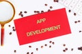 Business, programming, interface, application and network concept. Text APP DEVELOPMENT on the red card, top view Royalty Free Stock Photo