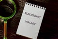 Business, programming, interface, application and network concept. Text ELECTRONIC WALLET in a notebook on a dark Royalty Free Stock Photo