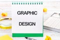 Business, programming, interface, application and network concept. Text GRAPHIC DESIGN in an upright notebook Royalty Free Stock Photo