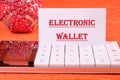 Business, programming, interface, application and network concept. Words ELECTRONIC WALLET written on a business card on Royalty Free Stock Photo