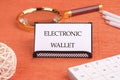 Business, programming, interface, application and network concept. Words ELECTRONIC WALLET written on a white business Royalty Free Stock Photo