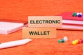 Business, programming, interface, application and network concept. Words ELECTRONIC WALLET written through wooden blocks Royalty Free Stock Photo