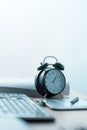 Business project deadline, vintage clock on office desk