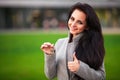 Business, real estate, banking and people concept - smiling business woman with keys over office room or new apartment background Royalty Free Stock Photo