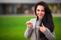 Business, real estate, banking and people concept - smiling business woman with keys over office room or new apartment background Royalty Free Stock Photo