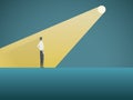 Business recruitment or hiring vector concept. Businessman standing in spotlight or searchlight as symbol of unique