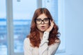 Business red-haired woman wearing glasses office manager Professional Royalty Free Stock Photo