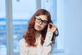 Business red-haired woman wearing glasses office manager Professional Royalty Free Stock Photo