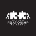 business relationship logo with using Two men push pieces of puzzle Royalty Free Stock Photo