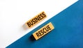 Business rescue symbol. Concept words Business rescue on wooden blocks on a beautiful white and blue background. Business rescue