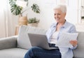 Business for Retirees. Senior Woman Working With Laptop And Documents At Home Royalty Free Stock Photo