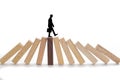 Business risks concept, Businessman walking on wooden blocks.