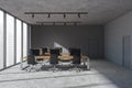 Business room interior with armchairs and computers on concrete floor, city view Royalty Free Stock Photo