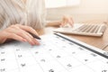 Business Scheduling. Unrecognizable Woman Working On Laptop And Checking Calendar At Workplace Royalty Free Stock Photo