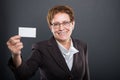 Business senior lady holding blank business card Royalty Free Stock Photo