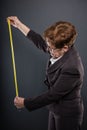 Business senior lady measuring with tape