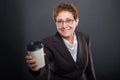 Business senior lady offering takeaway cup of coffee