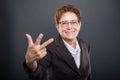 Business senior lady showing number three gesture Royalty Free Stock Photo