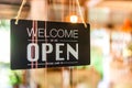 A business sign that says open on cafe or restaurant hang on door at entrance Royalty Free Stock Photo