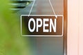 A business sign that says open on cafe or restaurant hang on door at entrance. Royalty Free Stock Photo