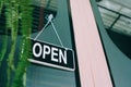 A business sign that says open on cafe or restaurant hang on door at entrance. Vintage color tone styl Royalty Free Stock Photo