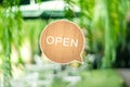 A business sign that says open on cafe or restaurant hang on door at entrance. Vintage color tone styl Royalty Free Stock Photo