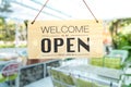 A business sign that says open on cafe or restaurant hang on door at entrance. Royalty Free Stock Photo