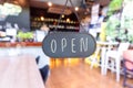 A business sign that says open on cafe or restaurant hang on door at entrance. Royalty Free Stock Photo