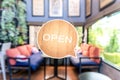 A business sign that says open on cafe or restaurant hang on door at entrance. Vintage color tone styl Royalty Free Stock Photo