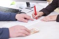 Business situation. Busineswoman signing loan contract,with money, Euro banknotes on Royalty Free Stock Photo