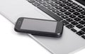 Business smartphone on the laptop Royalty Free Stock Photo