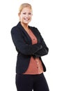 Business with a smile. A smiling young businesswoman standing with arms folded. Royalty Free Stock Photo